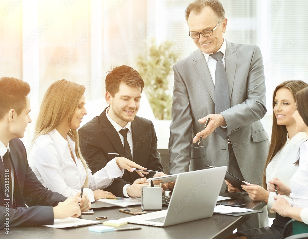 successful businessman and business team at a seminar in modern office successful businessman and business team at a seminar in modern office