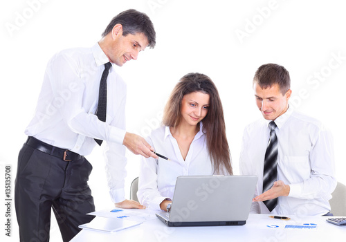 Group of business people working. Isolated on white background. Analyze the work looking at the laptop