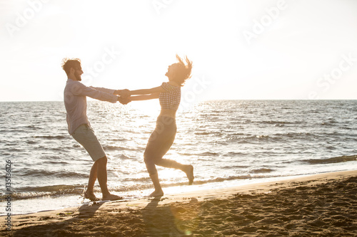 happiness and romantic Scene of love couples partners on the Beach photo