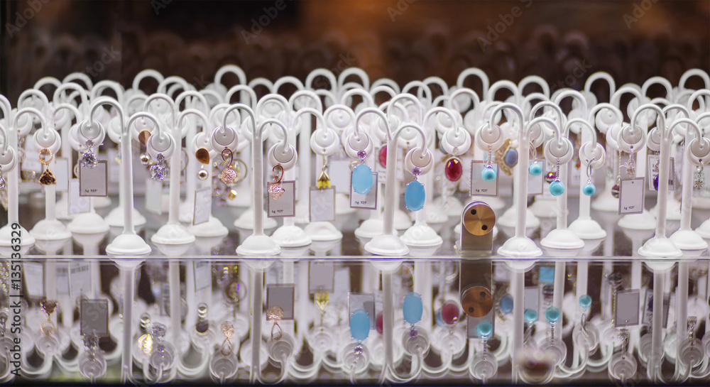 Many colorful earrings