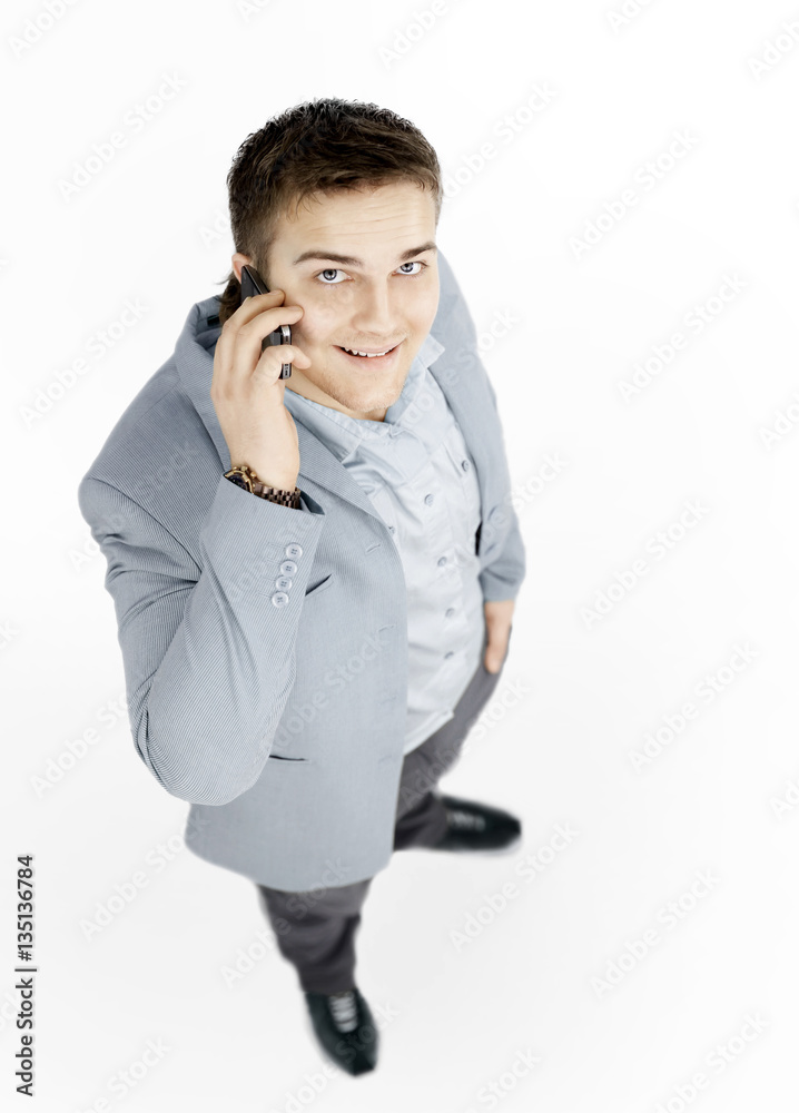 happy successful young businessman talking on mobile phone happy successful young businessman talking on mobile phone