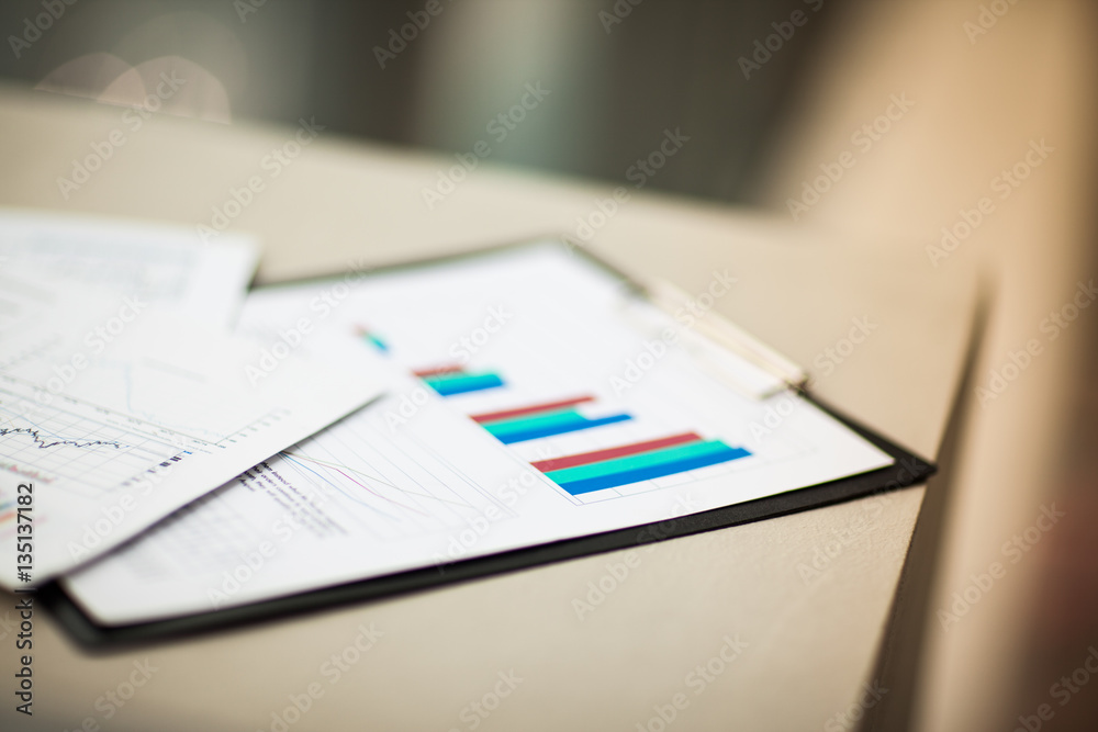financial charts and graphs on the table financial charts and graphs on the table