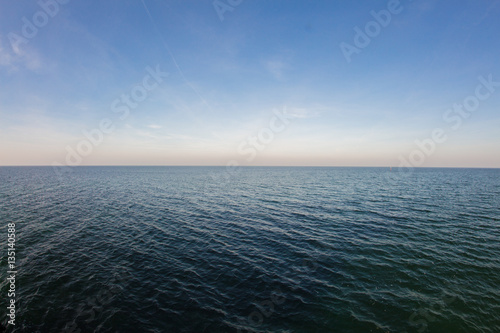 smooth sea with clear blue sky background at the baltic coast 