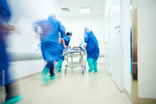 Doctors running for the surgery photo