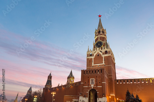 Iconic view of Spasskaya tower of Kremlin from the Red Square at sunset
