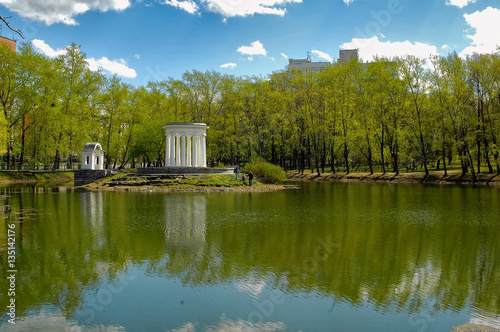 Ekaterinburg, Russia - May 18, 2006: Park of the estate of Kharitonov-Rastorguyev. Island with a stone rotunda on pond