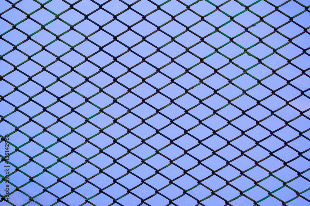 Background of painted metal grid in the snow Background of painted metal grid in the snow