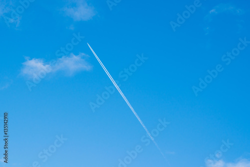 Bright blue sky with white clouds and then from the flying plane