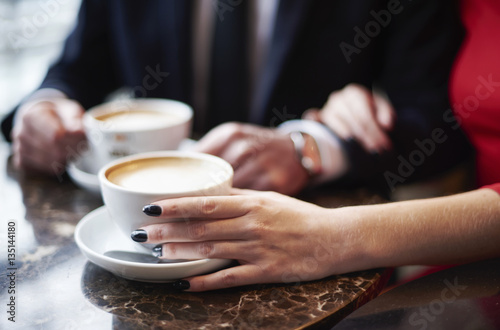 Close up of couple drinking coffee