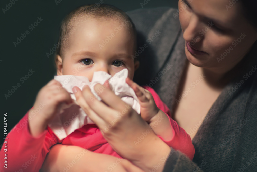Woman wipes snivels daughter with handkerchief Woman wipes snivels daughter with handkerchief