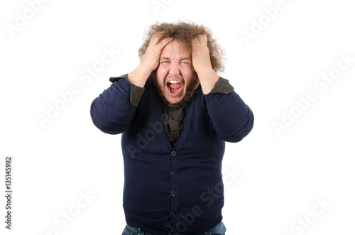 Rage, anger, irritation. Man shouts. Stress and Crisis. Headache. Man on a white background holding head and crying. 