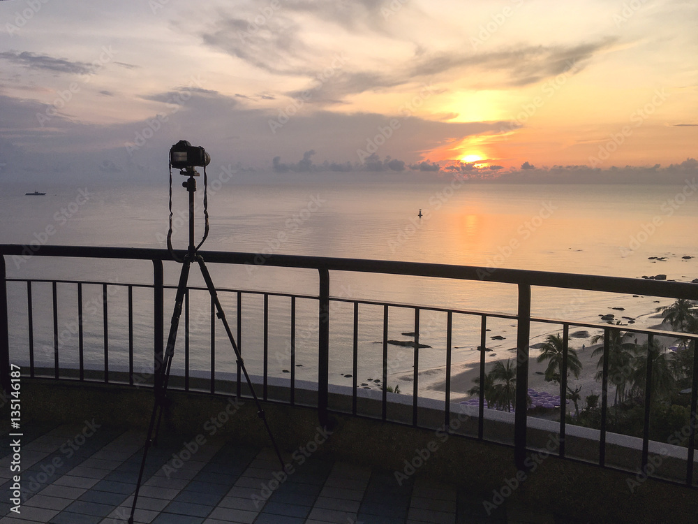 camera take sunrise picture over sea and beach at Hua Hin, Thailand