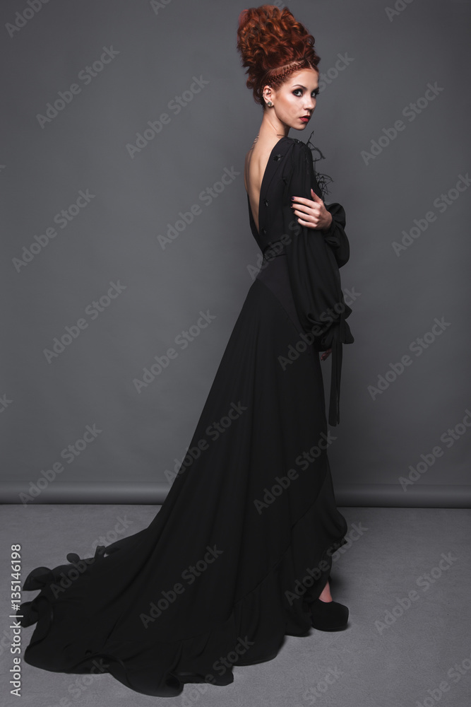 Beautiful girl in evening dress with avant-garde hairstyles. Beauty the face. Photos shot in the studio. Beautiful girl in evening dress with avant-garde hairstyles. Beauty the face. Photos shot in the studio.