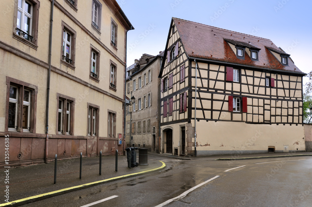 Street with authentic ancient half-timbered houses in Colmar, France.