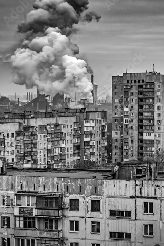 apartment buildings district and factory background, air pollution