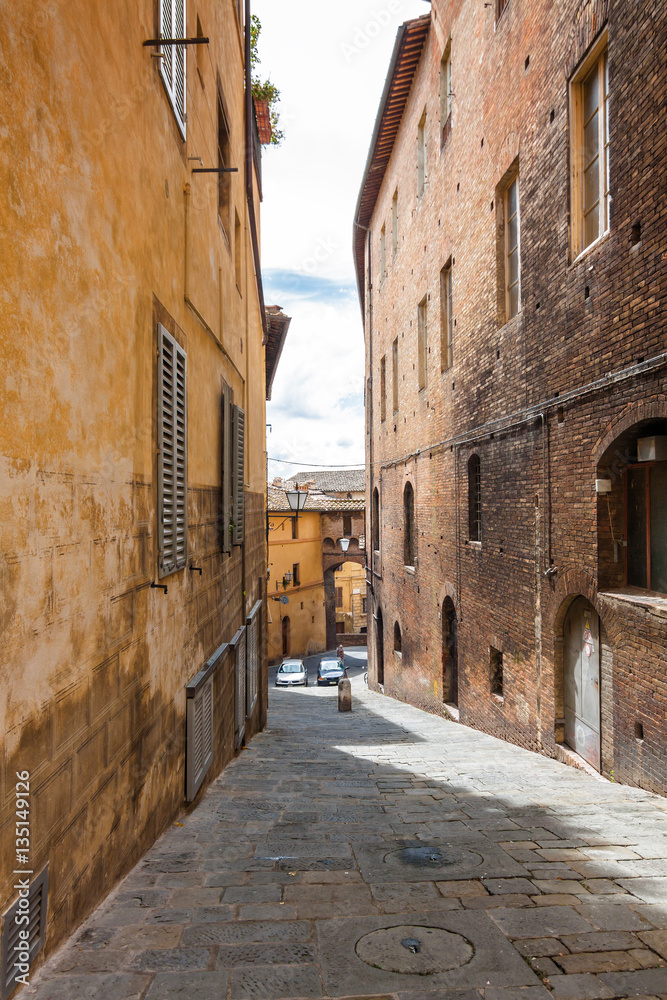 View of one of the streets of Siena, Toscana region, Italy.