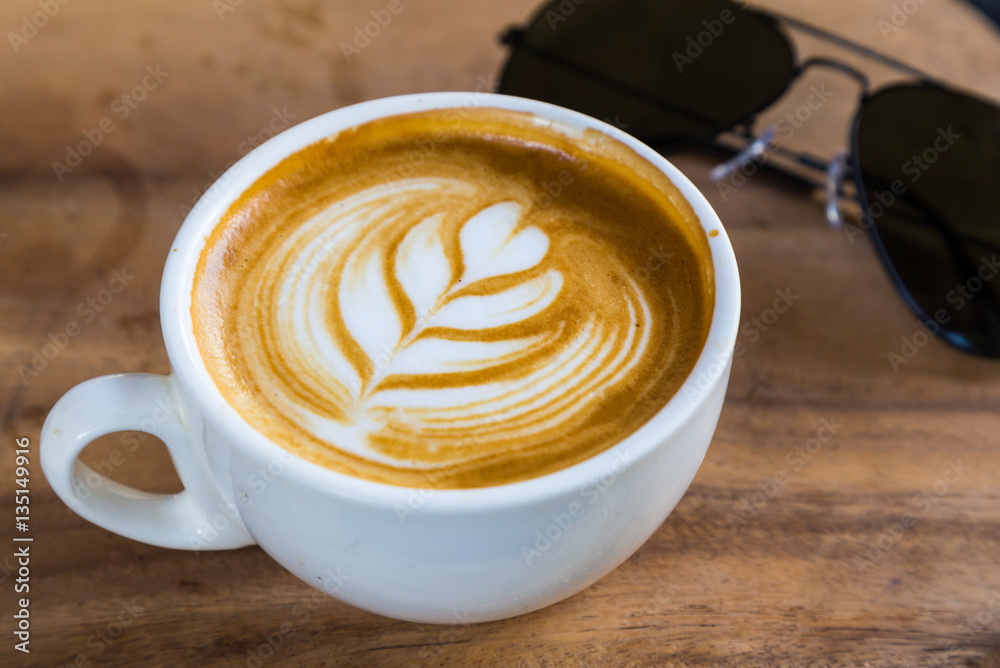 cup of latte coffee on wood table cup of latte coffee on wood table