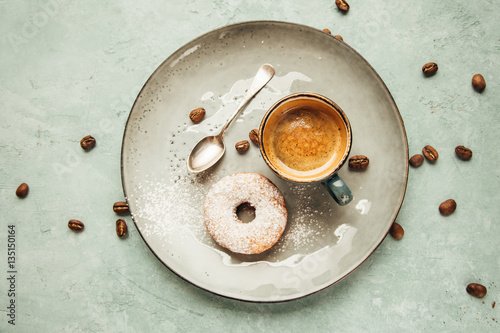 Coffee and homemade doughnut.