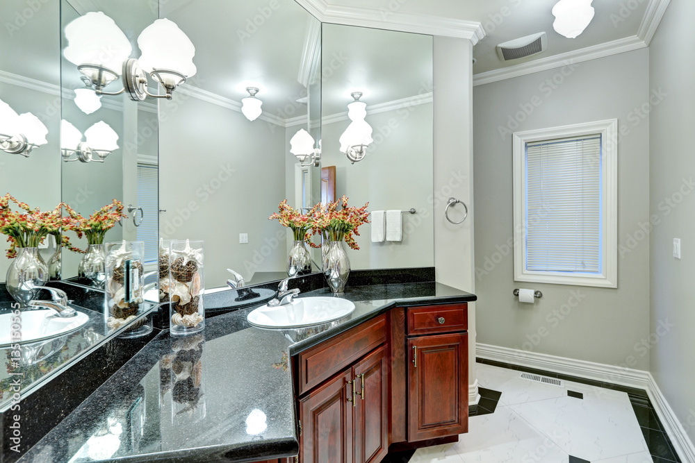 Soft grey bathroom interior boasts mosaic marble floor Soft grey bathroom interior boasts mosaic marble floor