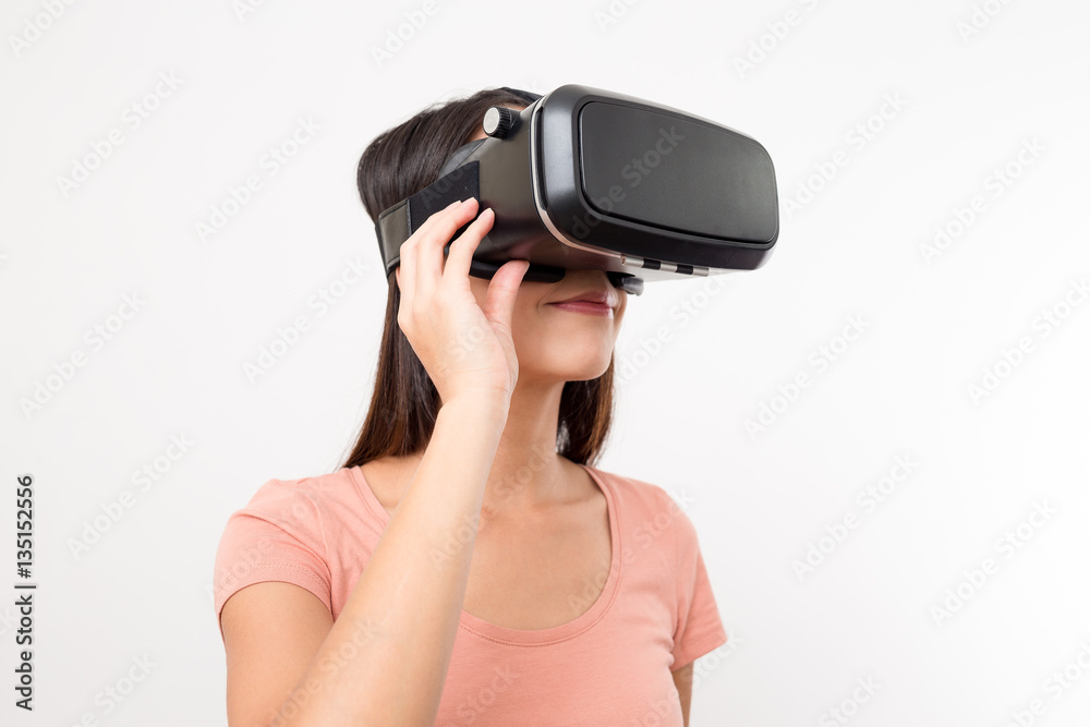 Asian Woman looking though Virtual reality glasses Asian Woman looking though Virtual reality glasses