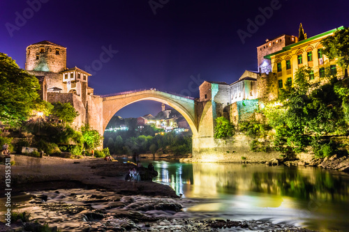 July 11, 2016: Stari Most bridge lit up by night in the town of Mostar photo