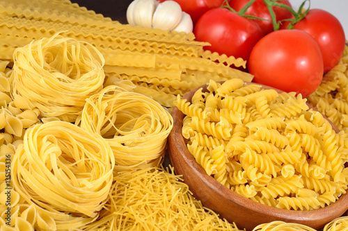 Italian pasta, ripe tomatoes branch and garlic