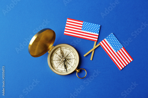 Two USA flags and compass o...