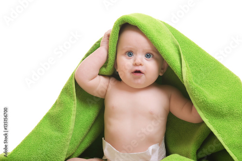 Cute baby with towel on whi...
