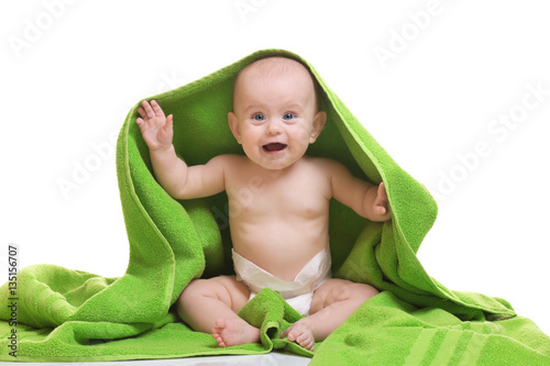 Cute baby with towel on whi...