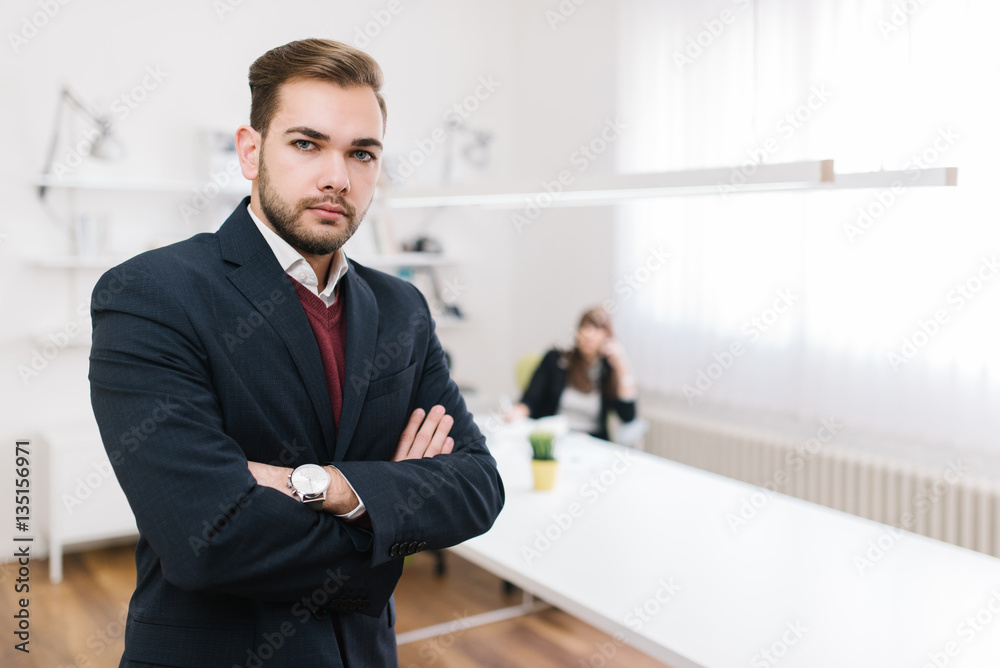 Prospective businessman standing in the foreground Prospective businessman standing in the foreground