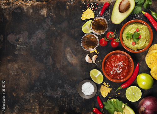 Green Homemade Guacamole with Tortilla Chips, Salsa and tequila