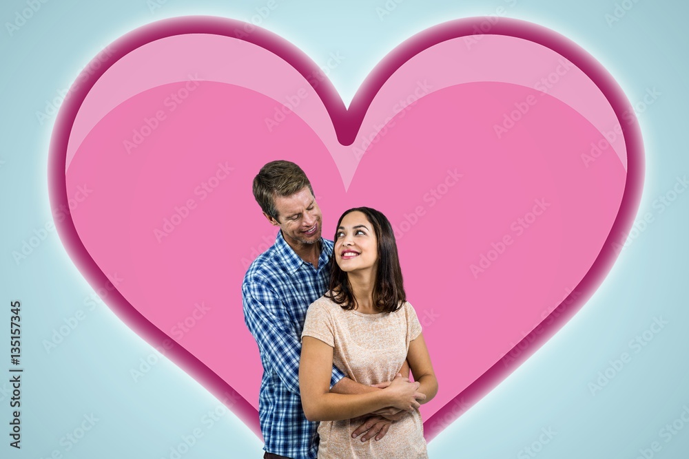 Composite image of romantic couple hugging Composite image of romantic couple hugging