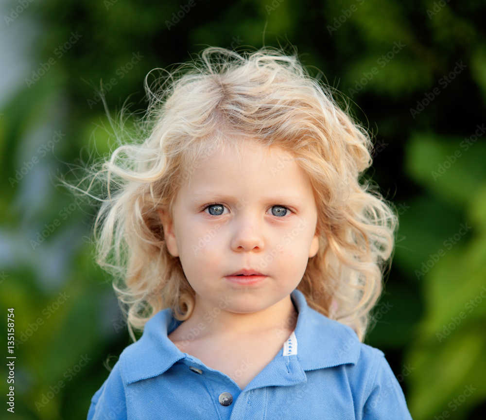 Beautiful boy three year old with long blond hair Beautiful boy three year old with long blond hair