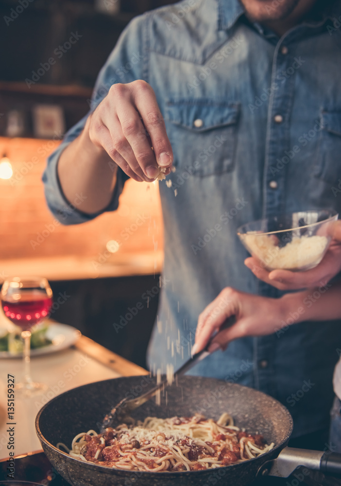 Fototapeta premium Beautiful couple cooking