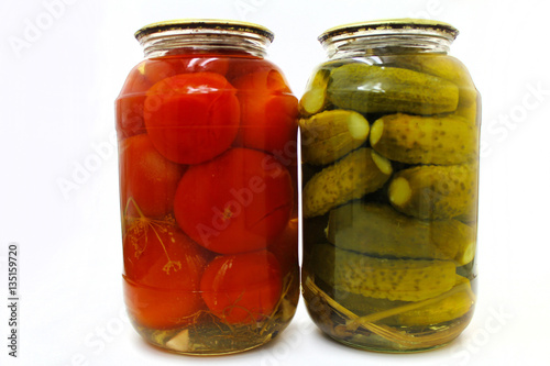 Home canning. Canned vegetables in glass jars on a white background