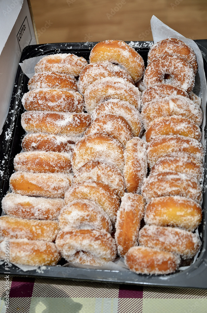 small donuts covered with sugar granules