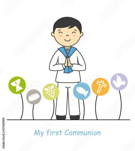 my first communion boy. Boy with communion suit and religious icons