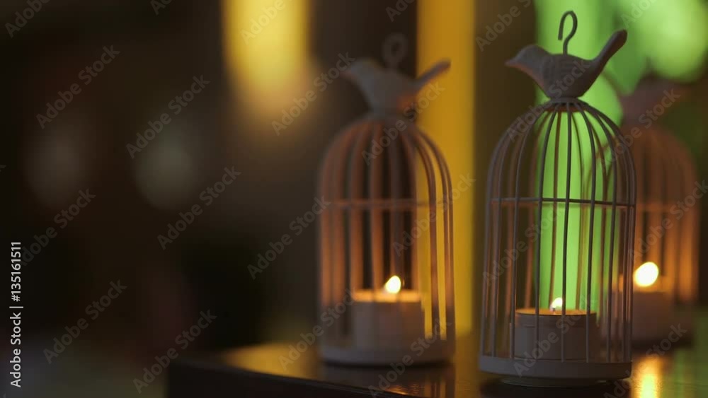 candles at the wedding table, Two decorative candles are lit on the table. candles at the wedding table, Two decorative candles are lit on the table.