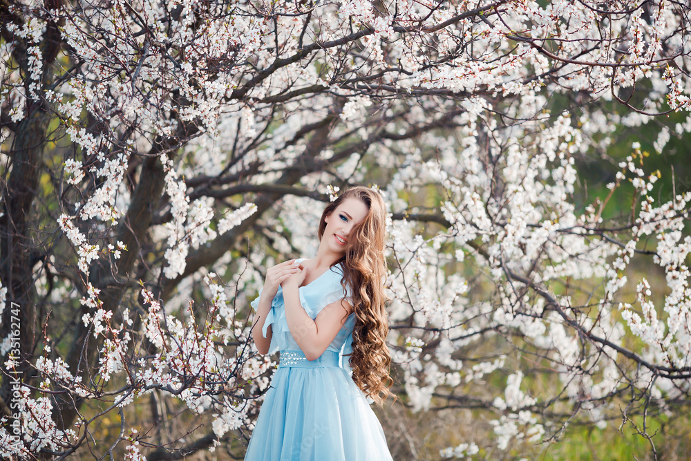 Spring smile. Happy beautiful smiling young woman in blossom park. Spring smile. Happy beautiful smiling young woman in blossom park.