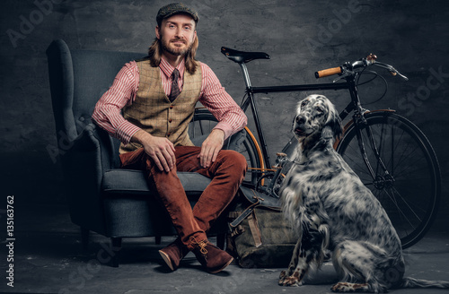 A man with Ireland setter dog. photo