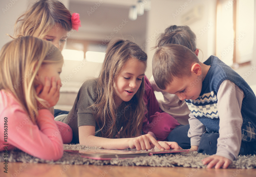 Fototapeta premium Large group of children lying on the floor.