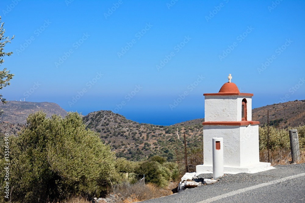 Small shrine along a mountain road with views towards the sea near Elounda, Elounda, Crete.
