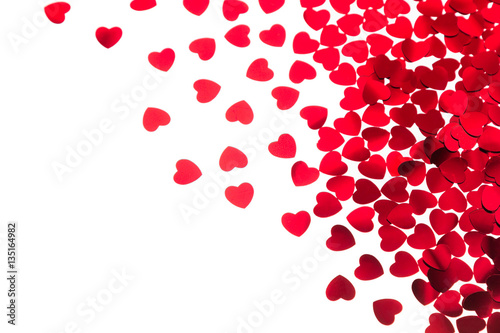 Fototapeta Naklejka Na Ścianę i Meble -   Valentine's day  decorative border of red hearts confetti isolated on white background. Festive valentine backdrop.