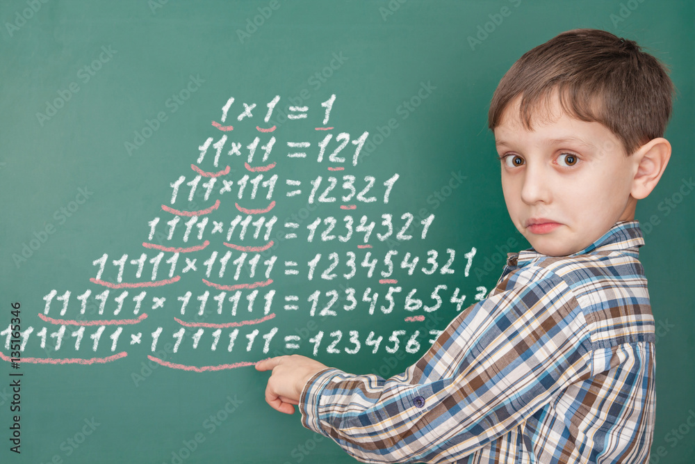 Education mathematics concept with a surprised boy Education mathematics concept with a surprised boy