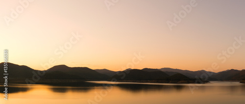 landscape view - sky,mountain and dam in evening time © ananaline