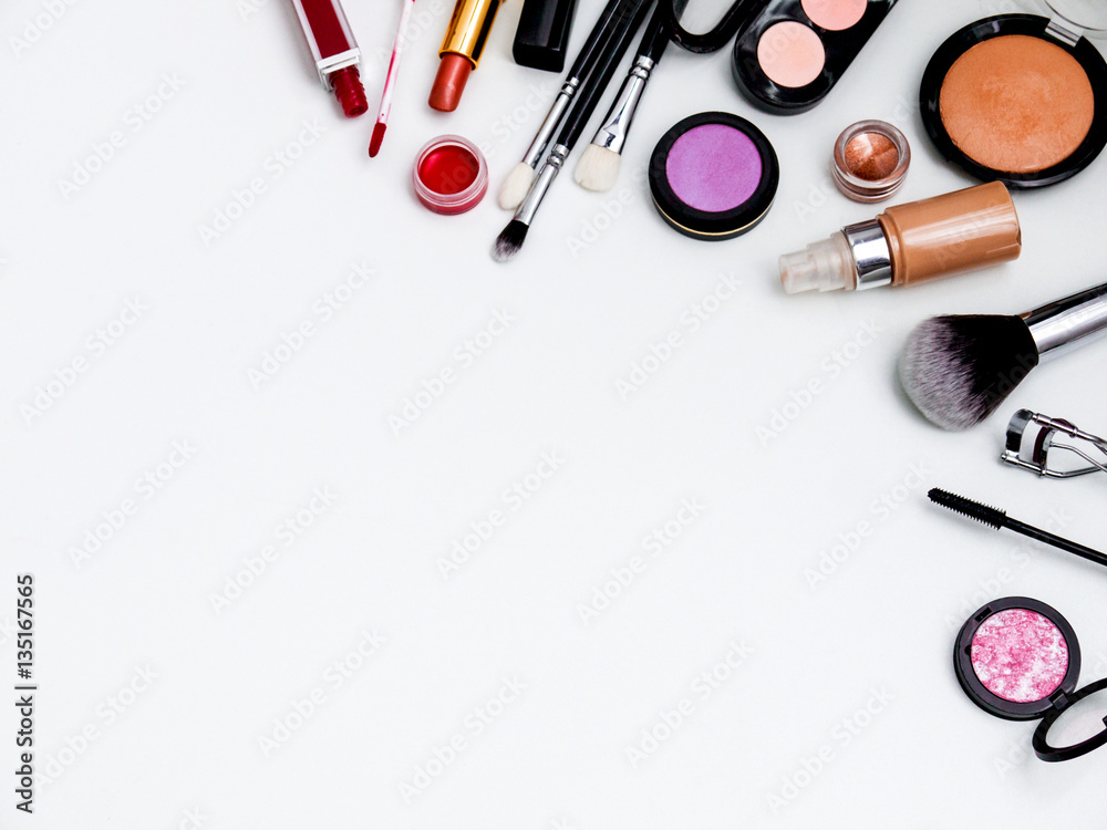 cosmetics top view isolated on white. Workplace, cosmetics, lipstick, nail Polish, mascara and eyeshadow cosmetics top view isolated on white. Workplace, cosmetics, lipstick, nail Polish, mascara and eyeshadow