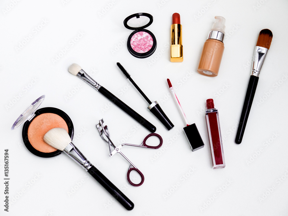 cosmetics top view isolated on white. Workplace, cosmetics, lipstick, nail Polish, mascara and eyeshadow cosmetics top view isolated on white. Workplace, cosmetics, lipstick, nail Polish, mascara and eyeshadow