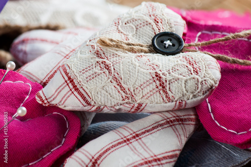 Heart made of cloth on wood desk