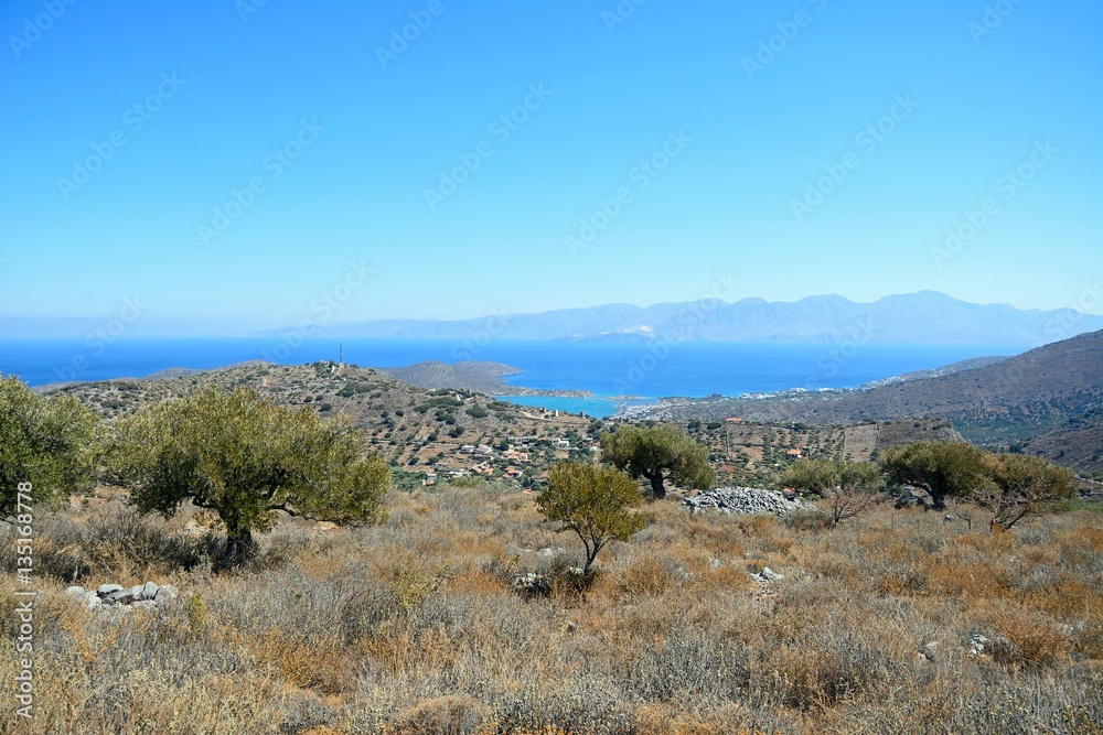 Elevated view of Elounda with views across the sea towards the island of Spinalonga, Elounda, Crete. Elevated view of Elounda with views across the sea towards the island of Spinalonga, Elounda, Crete.