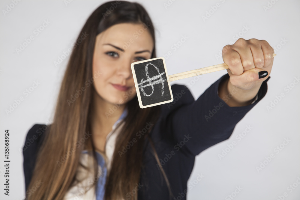 business woman shows a symbol of the dollar as a strong currency business woman shows a symbol of the dollar as a strong currency